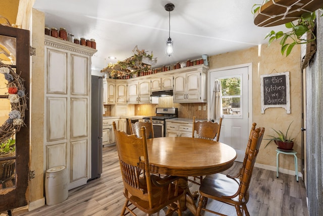 dining space with light hardwood / wood-style flooring