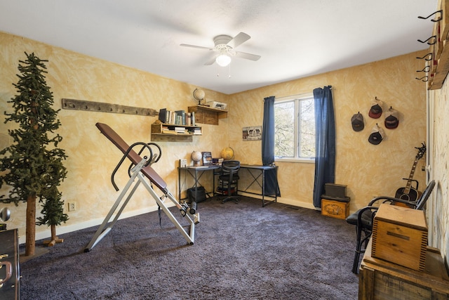 workout area featuring dark colored carpet and ceiling fan