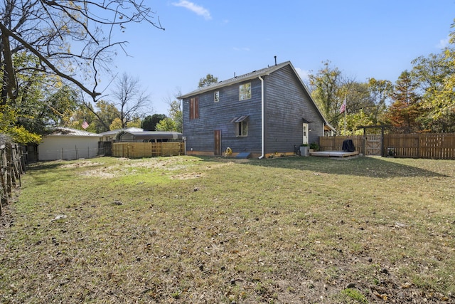 back of property featuring a lawn and central AC unit