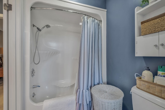 bathroom with toilet and shower / bath combo with shower curtain