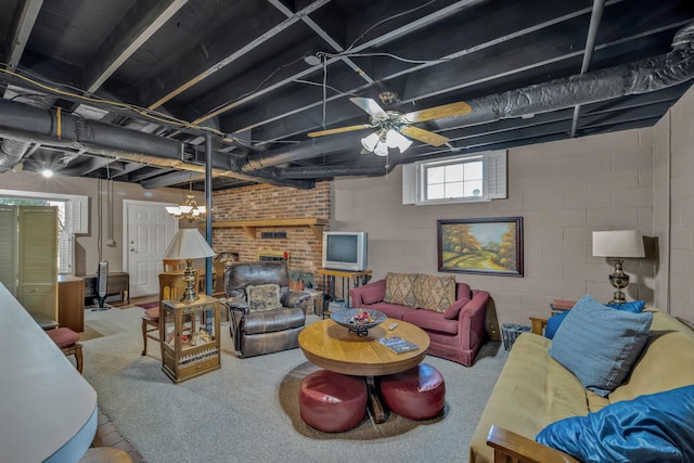 living room featuring ceiling fan and a fireplace