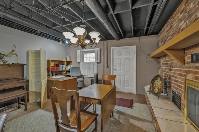 office featuring a chandelier and a fireplace