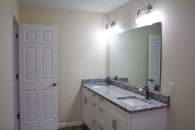 bathroom with double vanity and a sink