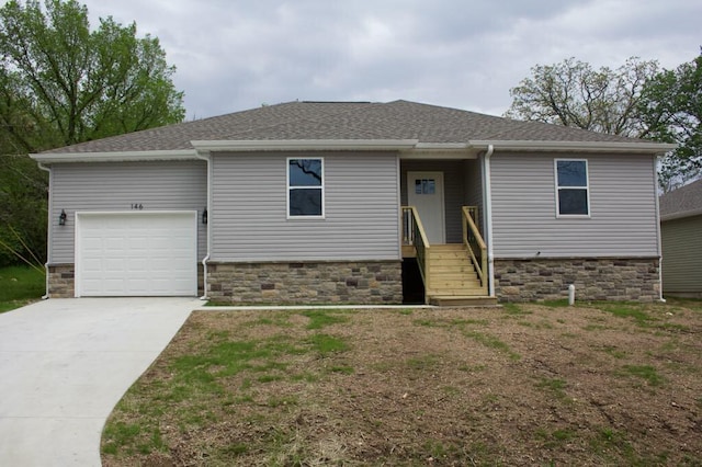 146 Mound St, Forsyth, MO 65653 - view of front of property featuring concrete driveway, stone siding, a shingled roof, and an attached garage