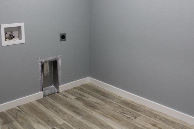 146 Mound St, Forsyth, MO 65653 - laundry room with electric dryer hookup, baseboards, hookup for a washing machine, wood finished floors, and laundry area