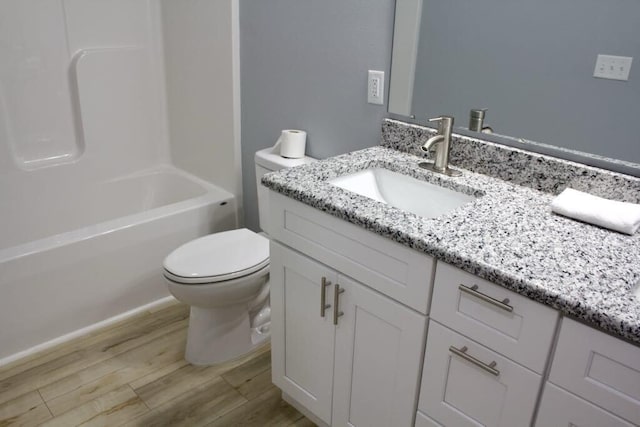 146 Mound St, Forsyth, MO 65653 - full bath with toilet, vanity, and wood finished floors