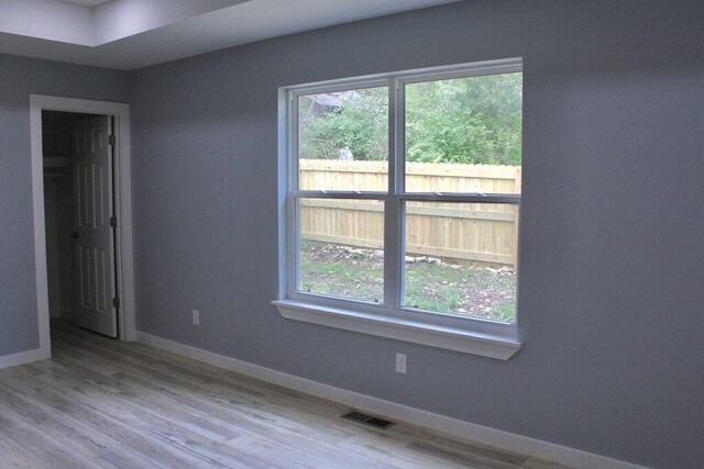 146 Mound St, Forsyth, MO 65653 - empty room featuring visible vents, wood finished floors, and baseboards
