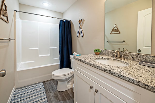 full bathroom featuring vanity, toilet, wood-type flooring, and shower / tub combo with curtain