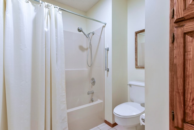 bathroom featuring tile patterned floors, shower / bath combination with curtain, and toilet