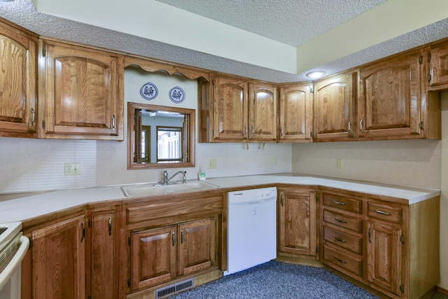 1462 E Powell St, Springfield, MO 65804 - kitchen with white dishwasher, a sink, brown cabinetry, and a textured ceiling