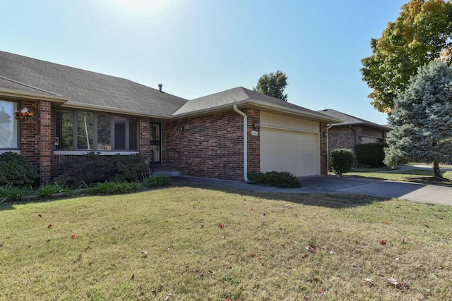 1462 E Powell St, Springfield, MO 65804 - ranch-style house with brick siding, an attached garage, a front lawn, and driveway