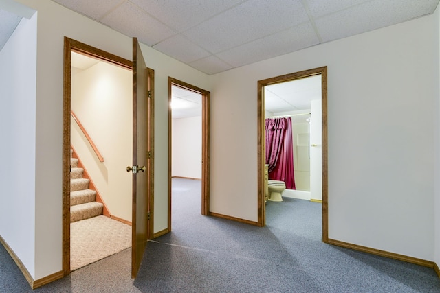 1462 E Powell St, Springfield, MO 65804 - corridor with a drop ceiling, carpet, stairs, and baseboards