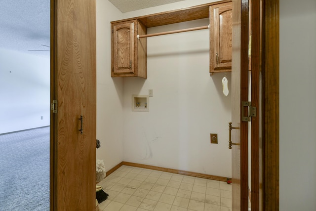 1462 E Powell St, Springfield, MO 65804 - washroom featuring cabinet space, hookup for a washing machine, and baseboards