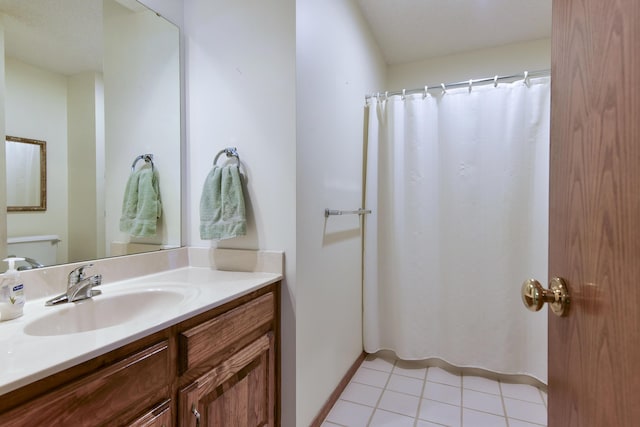 1462 E Powell St, Springfield, MO 65804 - full bathroom with tile patterned floors, vanity, toilet, and curtained shower