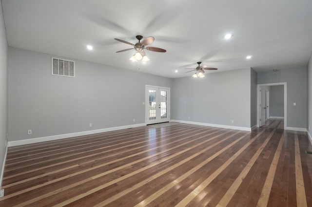 spare room with french doors, ceiling fan, and dark hardwood / wood-style flooring