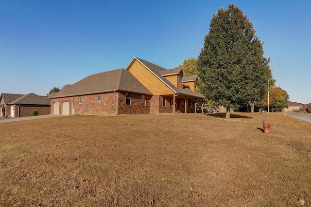 exterior space featuring a front yard and a garage