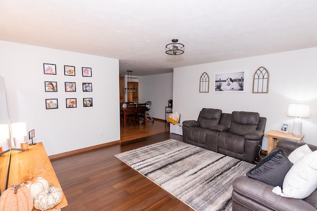 living room with dark hardwood / wood-style flooring