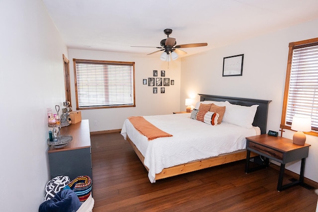 bedroom featuring ceiling fan and dark hardwood / wood-style floors