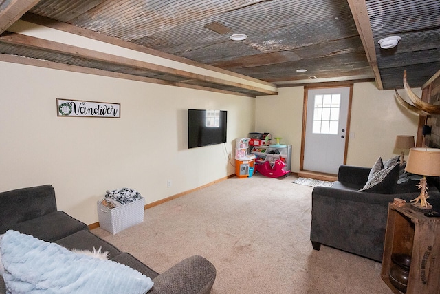 living room with light carpet and beamed ceiling