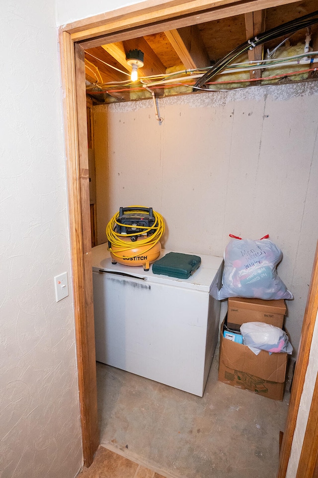 clothes washing area featuring washer / dryer