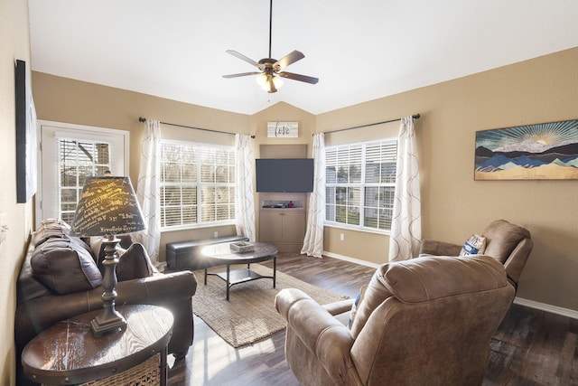 living room with lofted ceiling, dark wood-type flooring, and ceiling fan