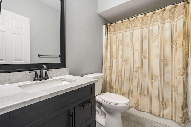 bathroom with vanity, toilet, tile patterned floors, and a shower with curtain