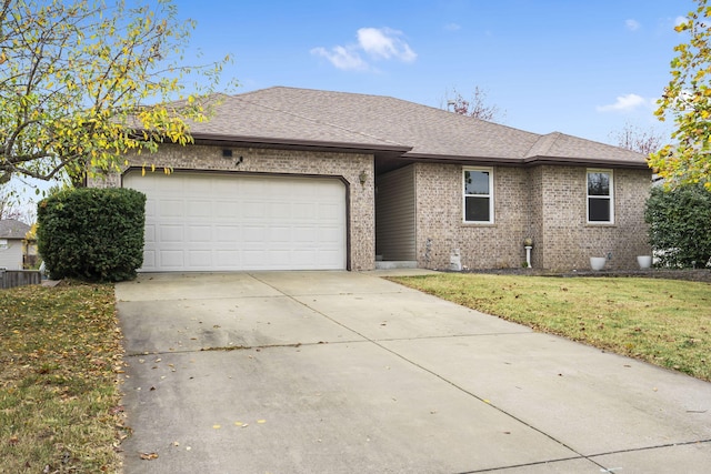 single story home with brick siding, a shingled roof, driveway, a front yard, and an attached garage