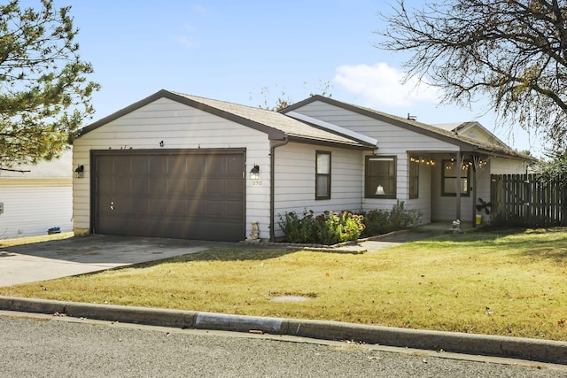 ranch-style house with a front lawn and a garage