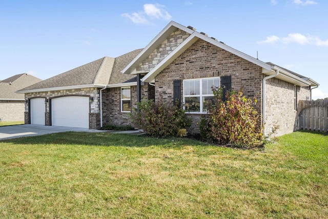 view of front of property with a garage and a front lawn