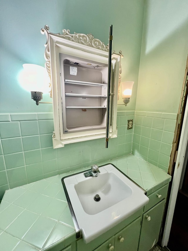 bathroom featuring vanity and tasteful backsplash