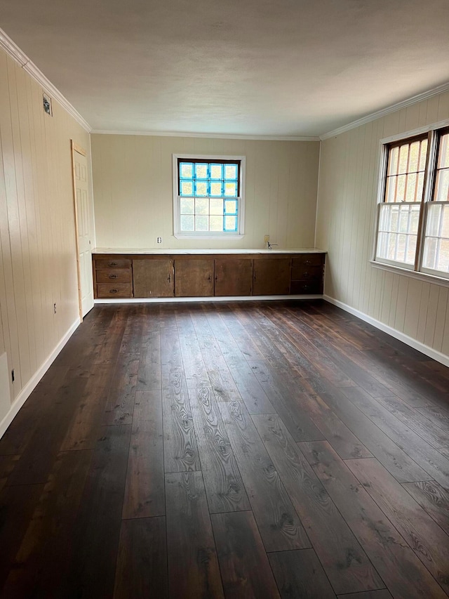 unfurnished room with crown molding and dark hardwood / wood-style flooring