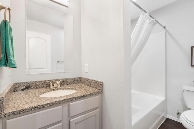 full bathroom featuring toilet, vanity, shower / bath combination with curtain, and wood-type flooring