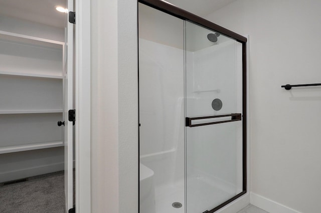 bathroom featuring walk in shower