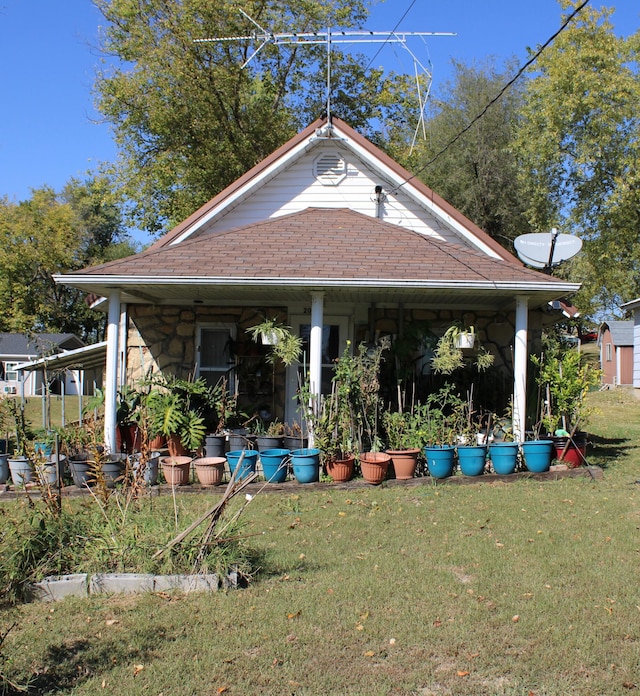 exterior space with a yard and covered porch