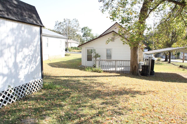 view of side of property with a lawn