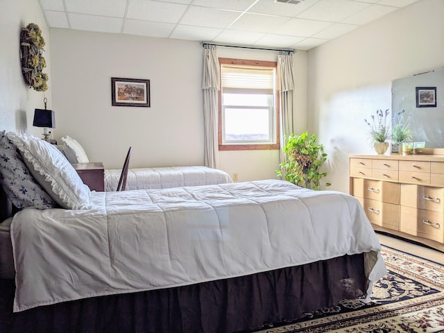 bedroom featuring a drop ceiling