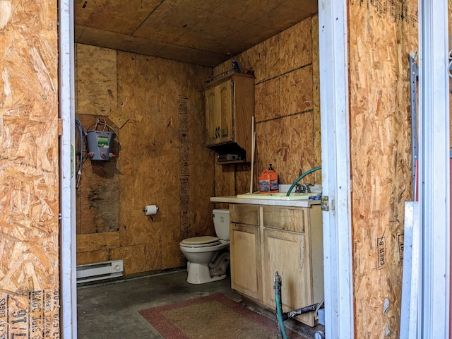 bathroom featuring toilet, concrete flooring, vanity, and a baseboard radiator