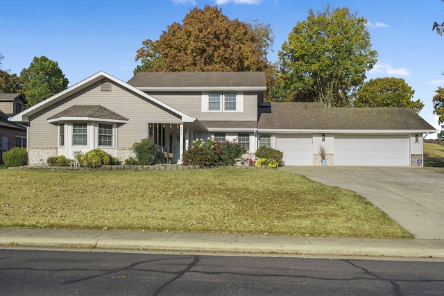 front of property with a front yard and a garage