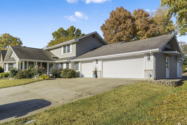 front facade featuring a front lawn and a garage