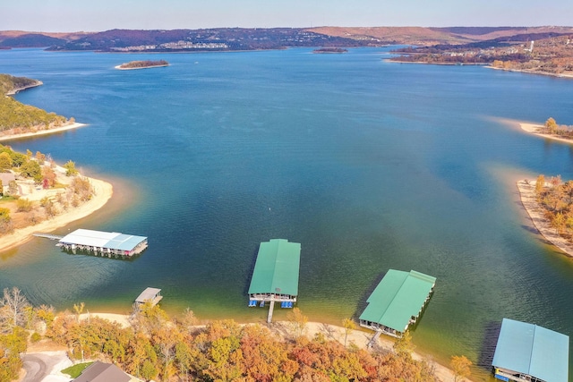 aerial view featuring a water and mountain view