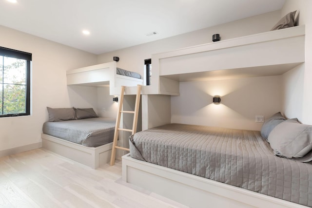 bedroom featuring baseboards, recessed lighting, and visible vents