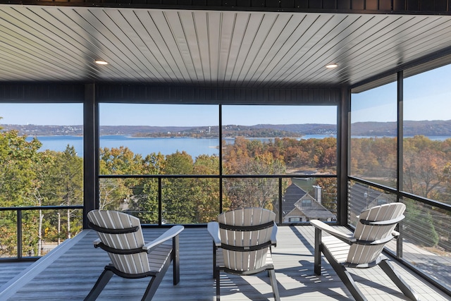 interior space featuring wood ceiling and a water and mountain view