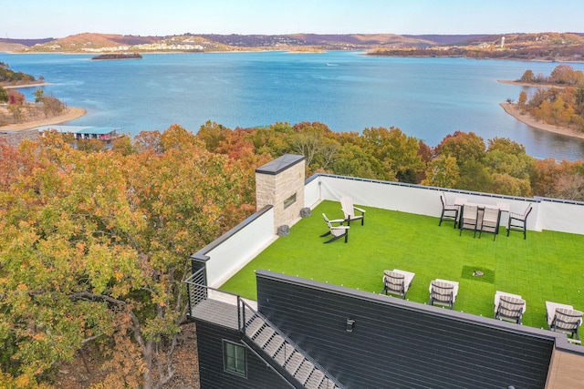 birds eye view of property featuring a water and mountain view