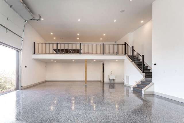 garage with baseboards, visible vents, and recessed lighting