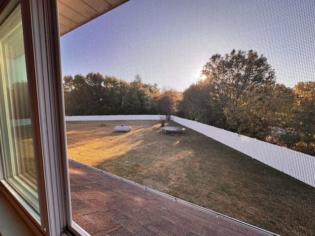 view of yard at dusk