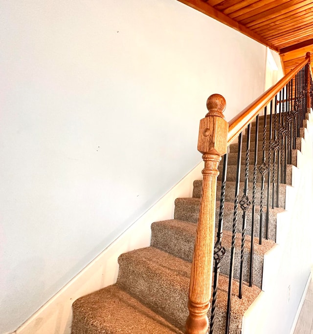 stairs featuring wood ceiling