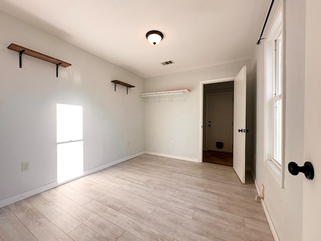 empty room featuring light hardwood / wood-style floors