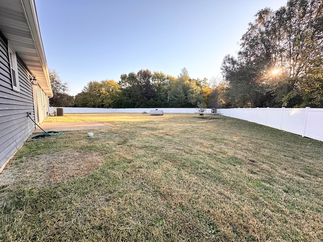 view of yard with central AC