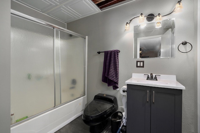 full bathroom featuring vanity, shower / bath combination with glass door, toilet, and tile patterned floors