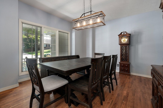 dining space with dark wood-type flooring